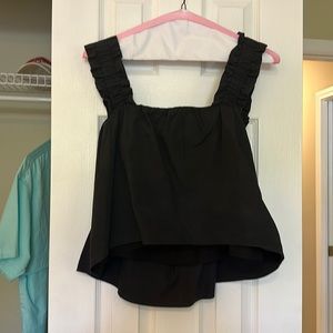 navy blue high low top with a ruffle sleeve